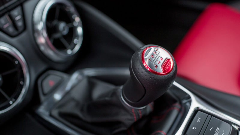Manual gear shifter with red trim