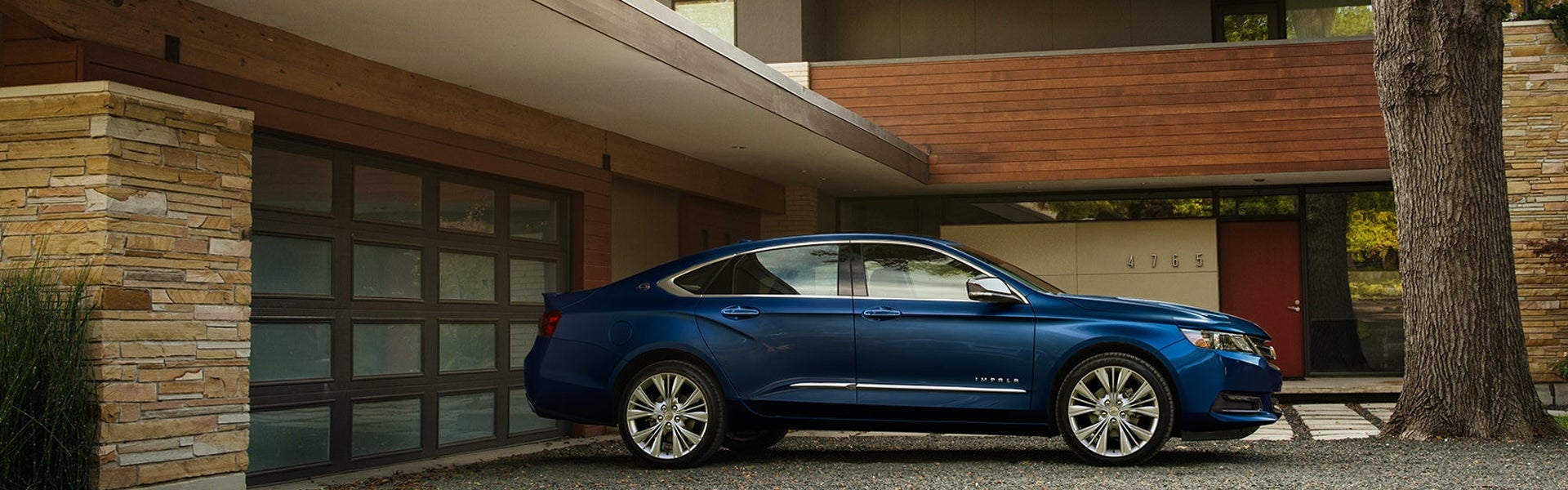 Chevrolet Impala Parked outside house